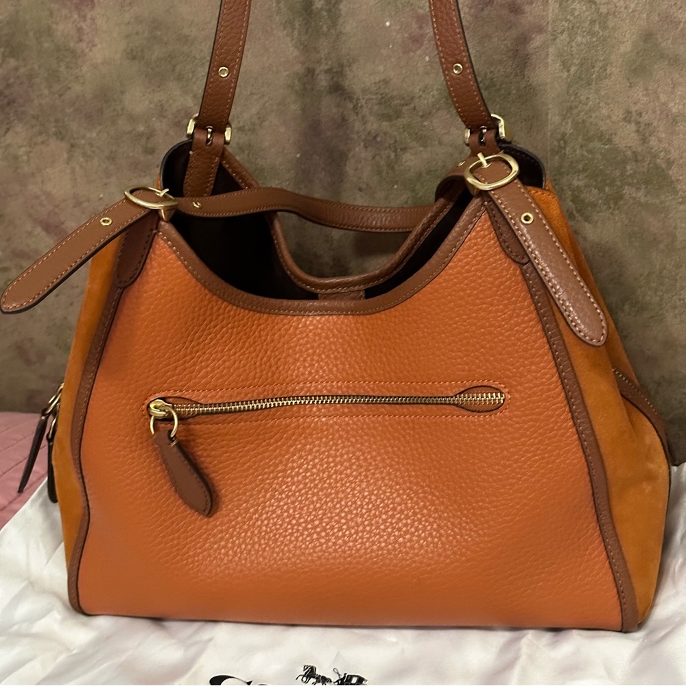 COPY - Coach with leather on front and back and Swede on the ends.